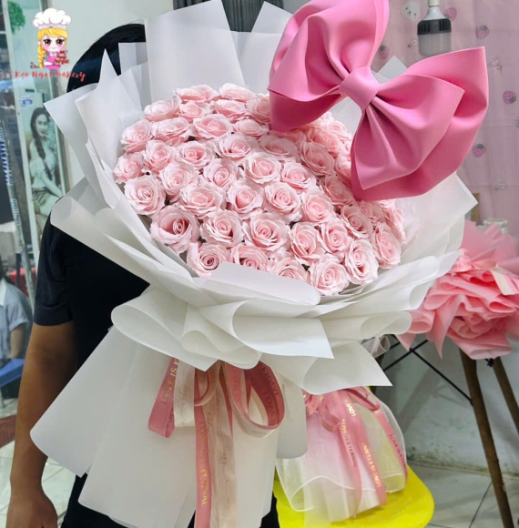 Hoa sáp mẫu bó tròn kèm nơ to tone hồng